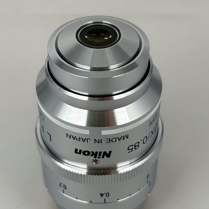 Nikon L Plan EPI CR 100x0.85 ∞/0-0.7 OFN25 MUE35900 Objective lens, high-precision optical component, made in Japan.