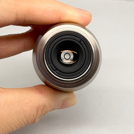 Nikon Plan Apo 60x1.40 Oil ∞/0.17 Ph3 DM WD 0.13 M25 Objecive held in hand to showcase optical features