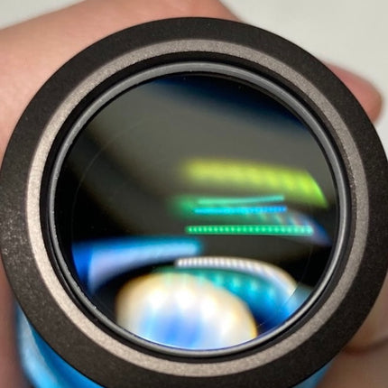Close-up of the Olympus XLMPlanFL N 10x0.30 ∞/0 DSX Infinity Microscope Objective lens showing optical performance.