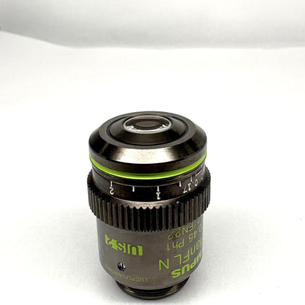 Olympus LUCPlanFL N 20x0.45 Ph1 ∞/0-2/FN22 UIS2 Objective lens with green markings and numeric aperture.