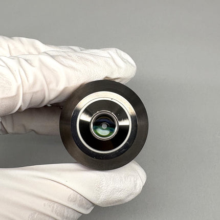 Close-up of Olympus LUCPlanFL 40x/0.60 RC3 ∞/0-2 Microscope Objective held in gloved hand.