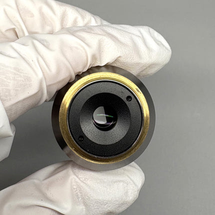Olympus LUCPlanFL 40x/0.60 RC3 ∞/0-2 Microscope Objective with a metallic lens held by gloved hand.