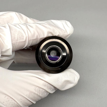 Olympus Microscpoe LUCPlanFL N 20X/0.45 ∞/0-2/FN22 UIS2 Objective held in hand to showcase optical features