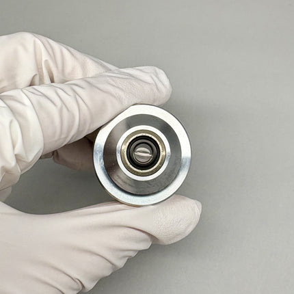 Zeiss EC Plan-NEOFLUAR 10x/0.3 Microscope Objective 420340-9900 M27 held in gloved hand.