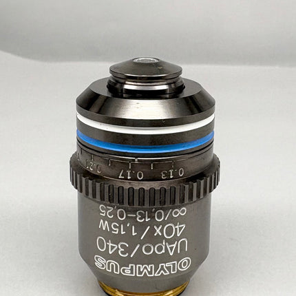 Olympus Microscope Objective UApo /340 40x1.15 W ∞/0.13-0.25 RMS lens shown from front view on a gray background