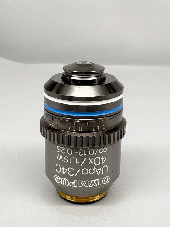 Olympus Microscope Objective UApo /340 40x1.15 W ∞/0.13-0.25 RMS lens shown from front view on a gray background