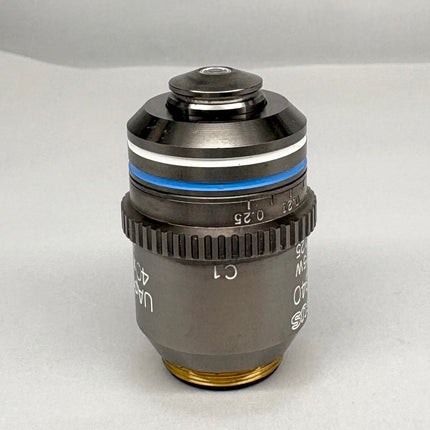 Olympus Microscope Objective UApo /340 40x1.15 W ∞/0.13-0.25 RMS shown from a front angle on a light background