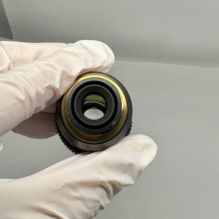 Olympus UPlanSApo 40x0.95 ∞/0.11-0.23/FN26.5 Microscope UIS2 Objective, showing objective lens in hand.