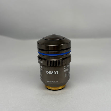 Olympus Microscope UPlanFL N 60x1.25 Oil Iris ∞/0.17/FN26.5 UIS2 Obj. shown from the side on a light background.
