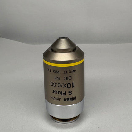 Nikon S Fluor 10x0.50 DIC N1 ∞/0.17 WD 1.2 Microscope Objective shown from an angled perspective.
