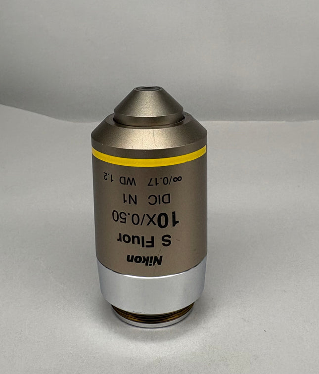 Nikon S Fluor 10x0.50 DIC N1 ∞/0.17 WD 1.2 Microscope Objective on a gray background