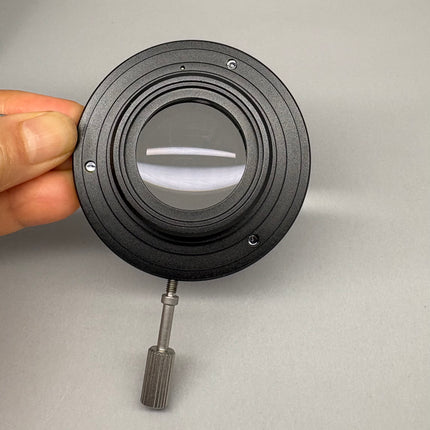 Olympus Microscope CX23-FS Condenser Auxiliary Lens held in hand to showcase optical features