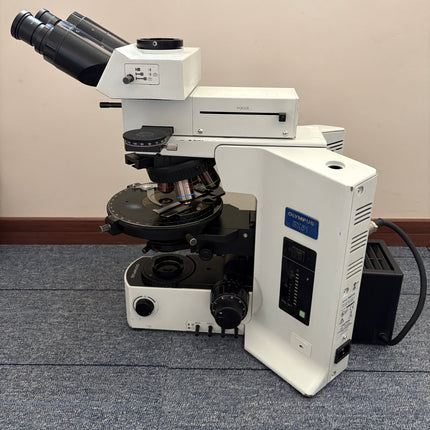 Olympus BX51 Polarizing Trinocular Microscope System with 4 UPlanFl P Objectives displayed at an angle.