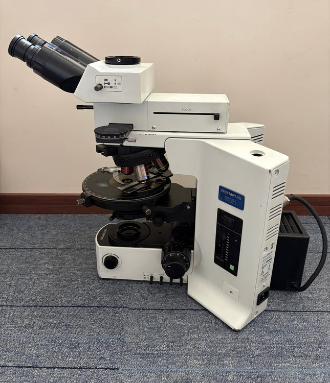 Olympus BX51 Polarizing Trinocular Microscope System with 4 UPlanFl P Objectives displayed at an angle.