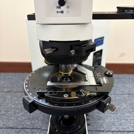 Olympus BX51 Polarizing Trinocular Microscope System with 4 UPlanFl P Objectives close-up of stage and Bertrand lens.