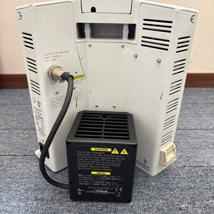 Back view of Olympus BX51 Polarizing Trinocular Microscope System with light source connection and power unit.
