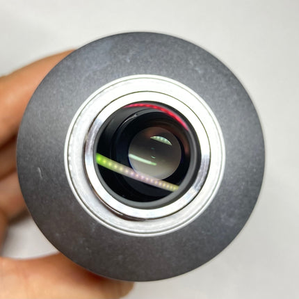 Nikon TV Lens C-0.45X MQD42040 C-Mount Camera/Photo Adapter held in hand to showcase optical features