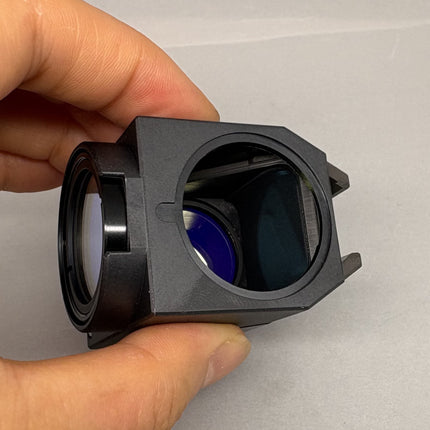 Olympus U-MNUA2 Fluorescence Filter Cube for BX2 IX2 Microscopes held in hand showing the filter design and lens.