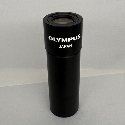 Olympus NFK 1.67x Microscope eyepiece Photo Relay lens black design with lens opening.