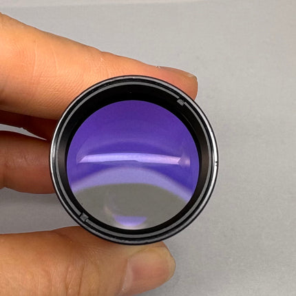 Olympus NFK 1.67x Microscope eyepiece Photo Relay lens view from the front, showcasing clean optical glass.