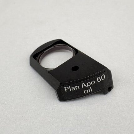 Nikon Plan Apo 60 oil DIC Nomarski Prism Slider f/ Plan Apo 60x oil Objective part showing the label Plan Apo 60 oil.