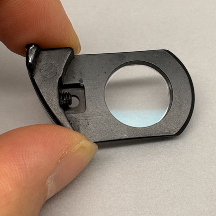 Nikon Plan Apo 60 oil DIC Nomarski Prism Slider f/ Plan Apo 60x oil Objective close-up view.