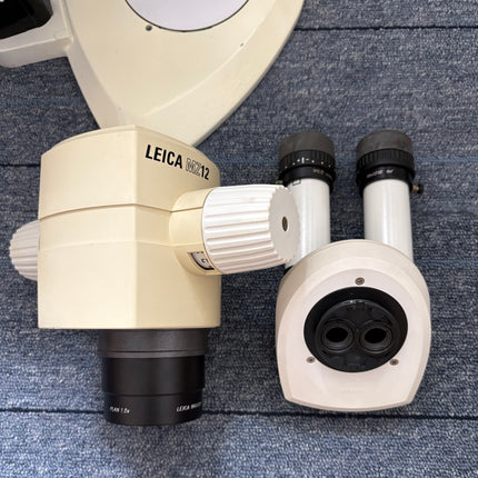 Leica MZ12 Stereo Microscope W/ 10X21B Eyepieces and PLAN 1.0x Objective components showing zoom body and binocular tube.
