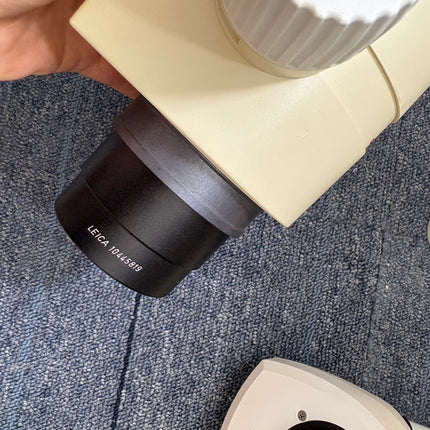 Leica MZ12 Stereo Microscope W/ 10X21B Eyepieces and PLAN 1.0x Objective eyepiece detail on microscope body.