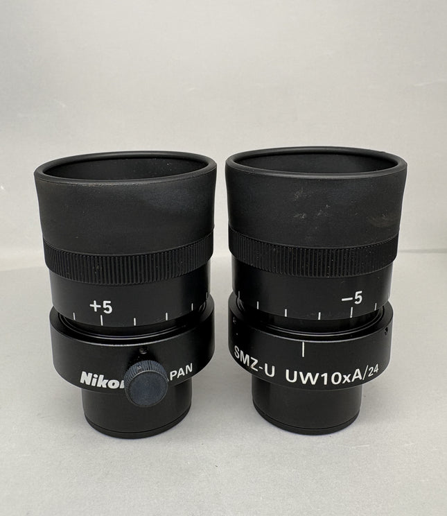 Pair of Nikon SMZ-U UW10xA/24 Microscope Eyepieces with adjustable focus and magnification settings.