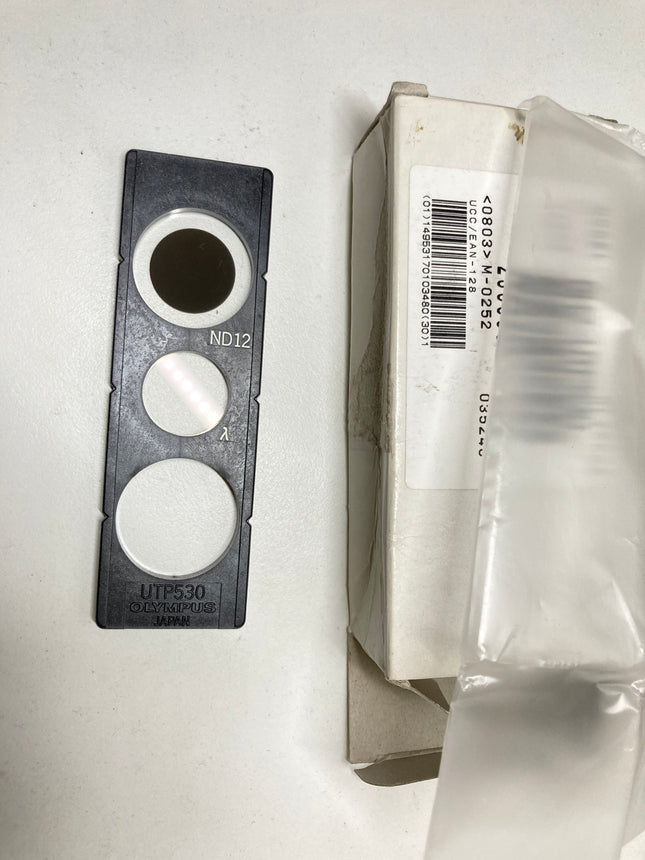 Olympus Microscope Slider BH2-UTP530 ND12 Full Lambda for BH2-UMA with packaging and plastic cover.