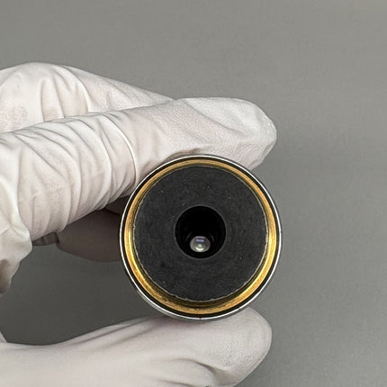Nikon Plan Apo 100x1.40 Oil ∞/0.17 DIC H Eclipse Objective held in hand to showcase optical features