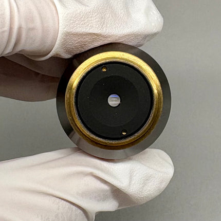 Olympus LCPlanFl 100x/0.80 LCD ∞/0.6-1.2 Microscope Objective shown in close-up view, highlighting optical condition.