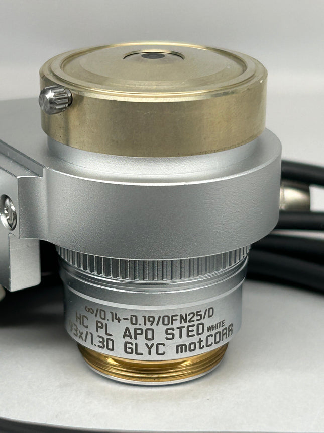 Leica Objective HC PL APO 93x/1,30 GLYC motCORR STED WHITE 506417 close-up view showing optical components and details.
