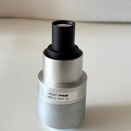 Nikon TV Lens C-0.6x MQD42060 C-Mount Camera/Photo Adapter on a white background.