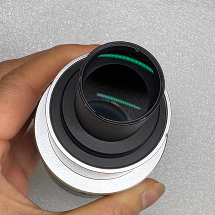 Nikon TV Lens C-0.6x MQD42060 C-Mount Camera/Photo Adapter showing optical components.