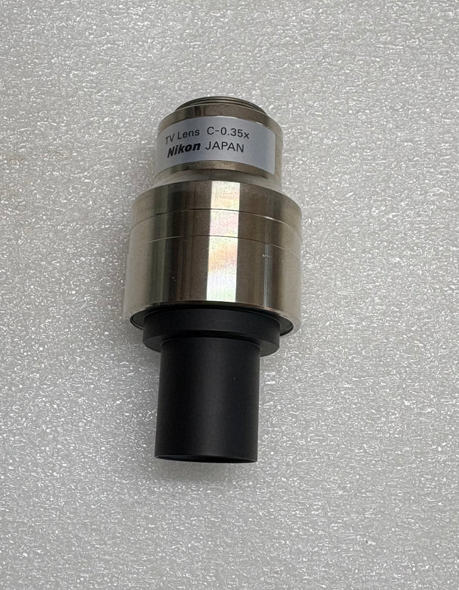 Nikon TV Lens C-0.35x C-Mount Camera/Photo Adapter image showing top view on a neutral background.