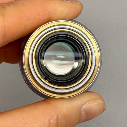 Leica Objective HC PL APO 20x/0,75 IMM CORR CS2 506343 M25 thread held in hand to showcase optical features
