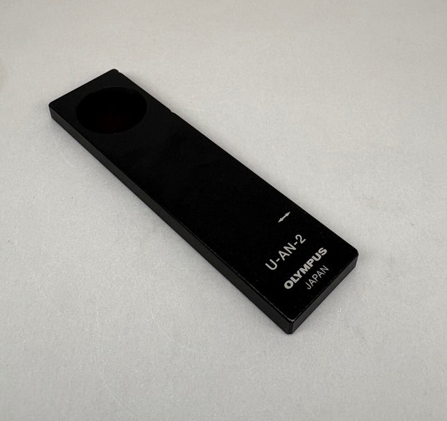 Olympus Microscope Analyzer Slider U-AN-2 on a light background, used but in good optical condition.