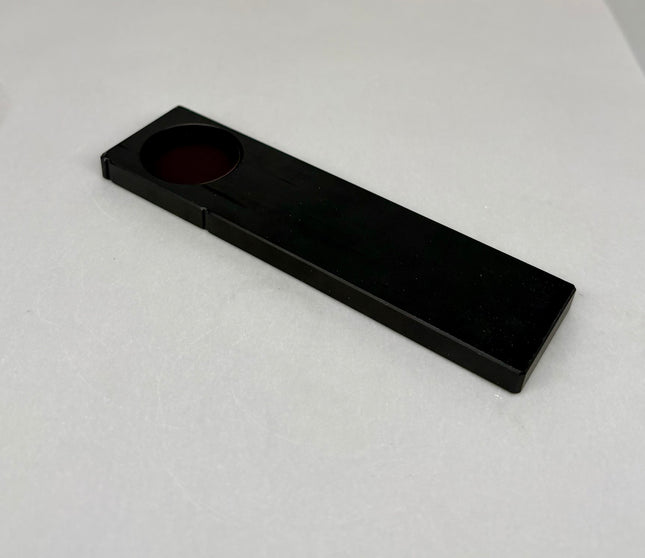 Olympus Microscope Analyzer Slider U-AN-2 showing a black rectangular slider with a circular lens.