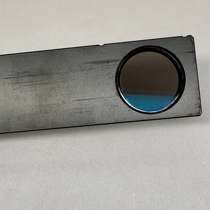 Olympus Microscope Analyzer Slider U-AN-2 held in hand to showcase optical features