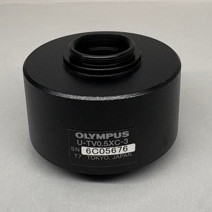 Olympus U-TV0.5XC-3 Microscope C-mount Camera Adapter showing black cylindrical design and label details.