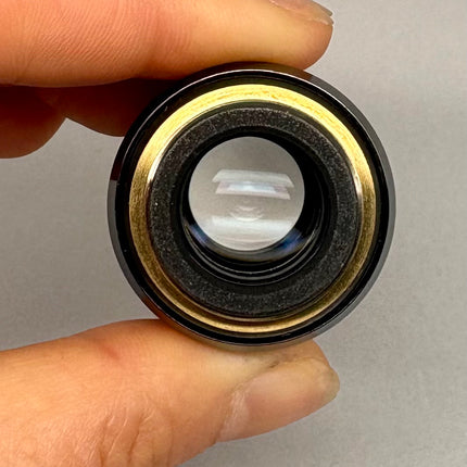 Olympus UPlanSApo 20x0.75 ∞/0.17/FN26.5 Microscope UIS2 Objective lens held in hand, showing detailed optics.