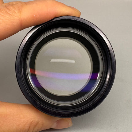 Leica Auxiliary Lens 0.32x 10446316 WD300mm f/S4E S6 S6E 52MM Thread, showcasing the lens glass held by a hand.