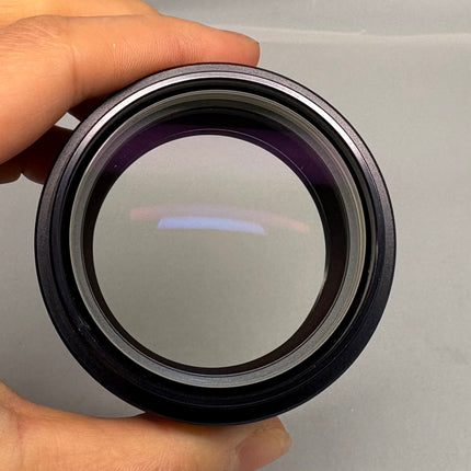 Leica Auxiliary Lens 0.32x 10446316 WD300mm f/S4E S6 S6E 52MM Thread showing the front lens element.