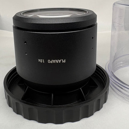 Leica PLANAPO 1.0x 10450028 Stereo Microscope Objective f/M-series lens on a black base.