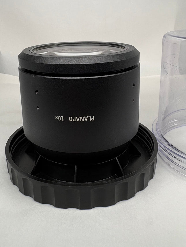 Leica PLANAPO 1.0x 10450028 Stereo Microscope Objective f/M-series lens on a black base.