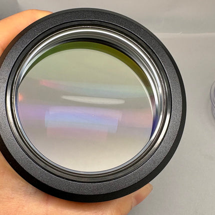 Leica PLANAPO 1.0x 10450028 Stereo Microscope Objective f/M-series lens in hand showing optical clarity and design.