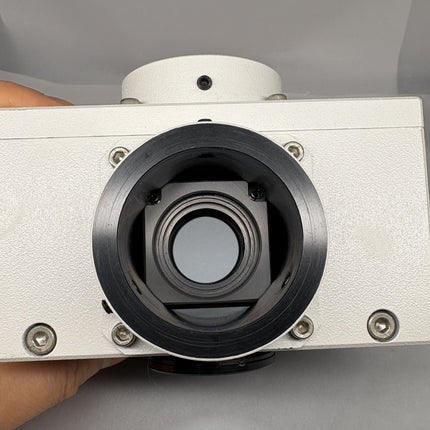 Front view of Nikon Y-QT dual camera port adapter for Eclipse, showcasing the lens opening and design details.
