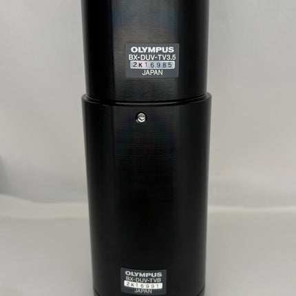 Olympus BX-DUV-TV3.5 / BX -DUV-TVB Microscope C-mount Camera Adapter in black with silver details.