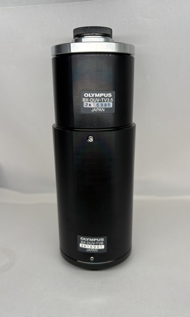 Olympus BX-DUV-TV3.5 / BX -DUV-TVB Microscope C-mount Camera Adapter in black with silver details.